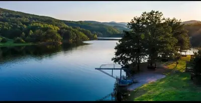 a view of a river with a bridge over it at Vila Tea Borsko Jezero in Bor