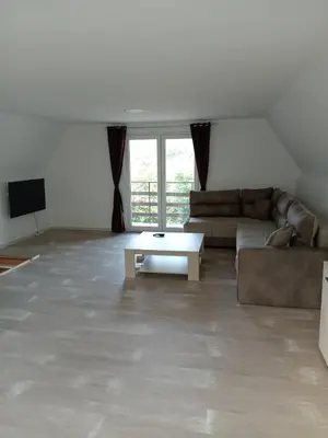a living room with a couch and a coffee table at Vila Tea Borsko Jezero in Bor