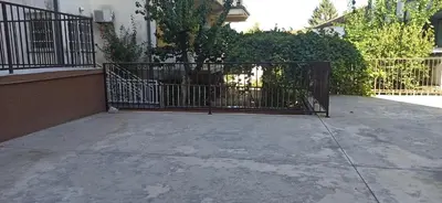 a iron gate in front of a building at Apartman Milutinovic in Vranje
