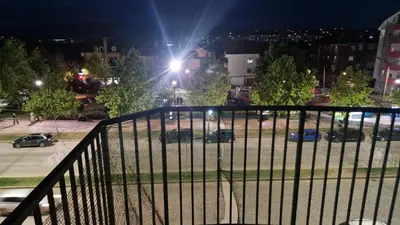 a view of a parking lot at night at JM Apartman in Donja Vrežina