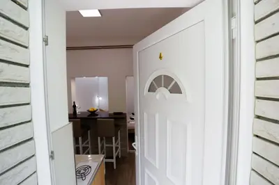 a door leading into a dining room with a table at Vila Jevtic studio 4 in Soko Banja
