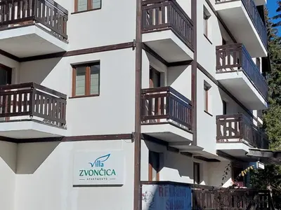 a building with balconies on the side of it at Vila Zvončica, apartman Puzović 21 in Kopaonik