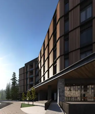a largeartment building with a bench in front of it at Woodside Apartments Kopaonik centar in Kopaonik