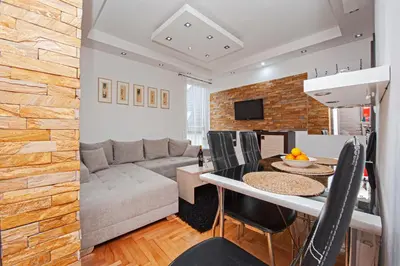 a living room with a couch and a table at Apartmancic Stancic in Kopaonik