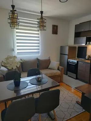 a living room with a couch and a table at Apartman Novak Sokobanja in Soko Banja