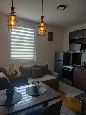 a living room with a couch and a table at Apartman Novak Sokobanja in Soko Banja