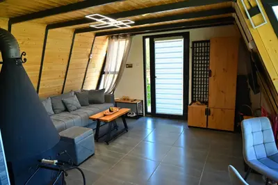 a living room with a couch and a table at Gočki Raj in Goč