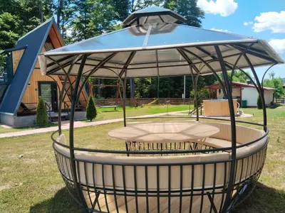 a circular object with an umbrella in a park at Gočki Raj in Goč