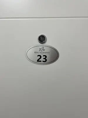 a sign on a door with the number on it at Apartman Nika Vb in Vrnjačka Banja