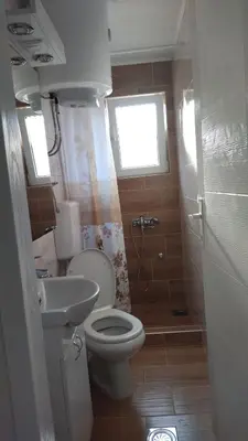 a small bathroom with a toilet and a sink at Alđo in Soko Banja
