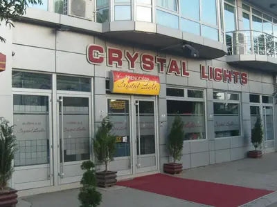 a building with a sign on the front of it at HOTEL Crystal Lights in Pirot
