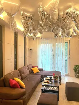 a living room with a couch and a table at Art Lux apartman in Kruševac