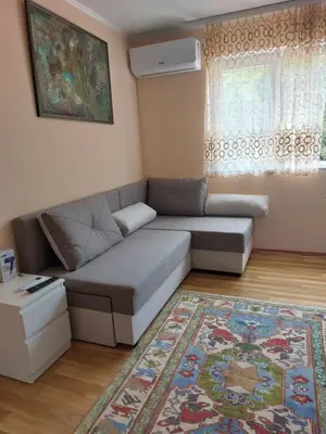 a living room with a couch and a rug at Dukat 2 in Soko Banja