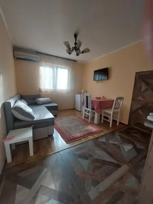 a living room with a couch and a table at Dukat 3 in Soko Banja