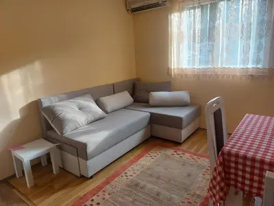 a small living room with a couch and a table at Dukat 3 in Soko Banja