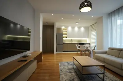 a living room with a couch and a table at NOVA Apartmani in Kraljevo