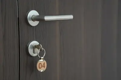 a door with a key tag on it at NOVA Apartmani in Kraljevo