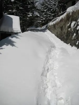 a pile of snow next to a wall at Guesthouse Šejn in Kopaonik