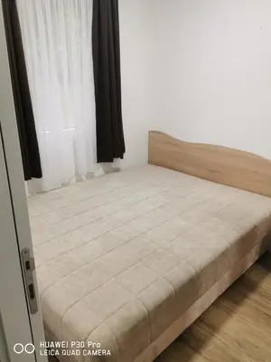 a small bed in a room with a bed frame at Bela Idila - Kopaonik in Kopaonik