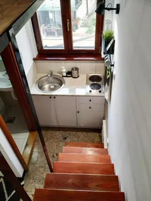 a stairway leading to a sink and a sinkessment at Vrnjačka Banja - Apartman Zen in Vrnjačka Banja