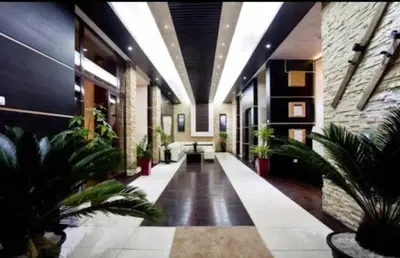 a hallway with potted plants in a building at Apartment 111 at Zoned Apart Hotel & Spa - Apartman 111 u hotelu Zoned in Kopaonik