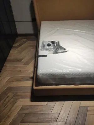 a pair of shoes sitting on top of a bed at Floid in Niš