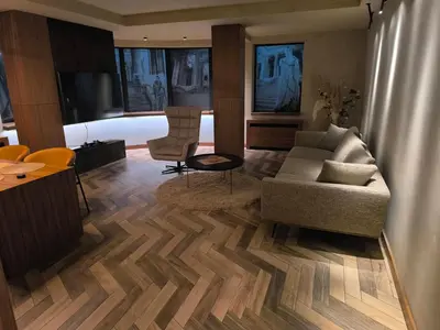 a living room with a couch and a table at Floid in Niš