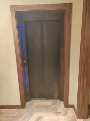 an open door with blue lights in a room at Floid in Niš