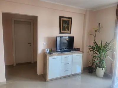 a living room with a tv on top of a cabinet at Apartman Goca in Vrnjačka Banja