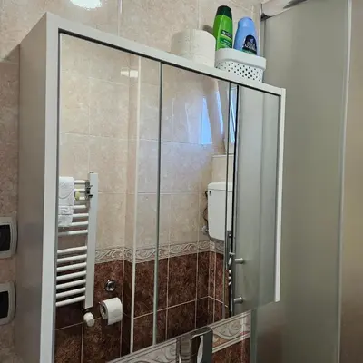 a shower stall in a bathroom with a toilet at ONLY 4 YOU apartment in Niš