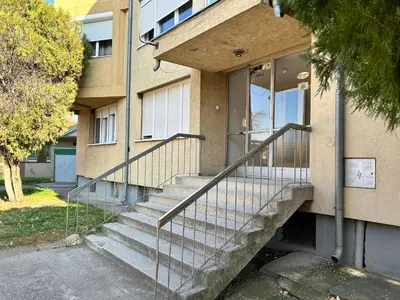 a building with stairs in front of a building at Apartman NANA in Ćuprija