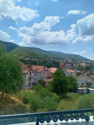 a view of a town with mountains in the background at NinaRelax in Soko Banja