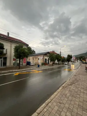 an empty street in a town on a cloudy day at Apartman Nestoria Sokobanja in Soko Banja