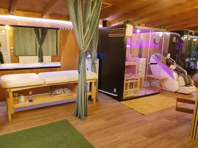 a room with a bed and a couch and a table at Odmaraliste Kod Mice Apartman 5 in Krušar