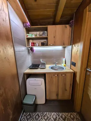 a small bathroom with a sink and a toilet at Odmaraliste Kod Mice Apartman 5 in Krušar