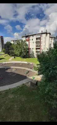 a large building with a skate park in front of it at ZONA apartman in Vranje