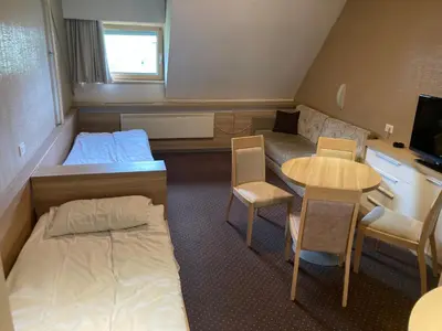 a small room with a bed and a small table at Ski centar konaci Kopaonik in Kopaonik