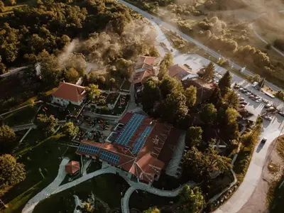 an overhead view of a house with a pool at Etno hotel Balasevic Rtanj in Boljevac