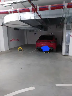 a red car is parked in a garage at Jagodina apartman MM AKVA PARK free garaža in Jagodina