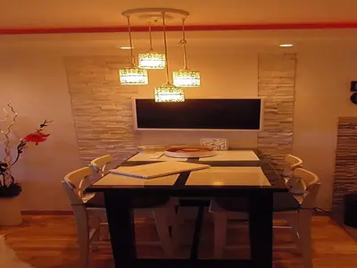 a dining room with a table and chairs at Visnja Apartment in Kopaonik