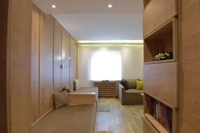 a living room with a couch and a window at Apartmani Kopaonik Centar Maglic in Kopaonik