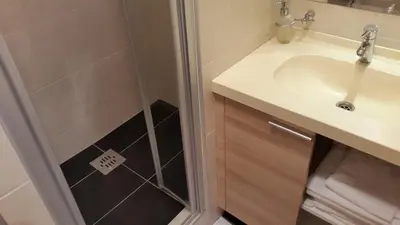 a bathroom with a shower and a sink at Apartmani Kopaonik Centar Maglic in Kopaonik