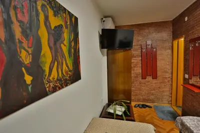 a room with a large painting on the wall at Smeštaj Đorić in Leskovac