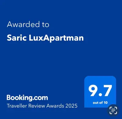 a blue screen with the text emailed to santa lucia experiment at Saric LuxApartman in Kruševac