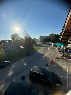 a black car parked in a parking lot at Sofi IV in Niš