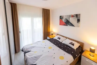 a bedroom with a bed with polka dots on it at Relax in Vranje