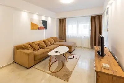 a living room with a couch and a table at Relax in Vranje