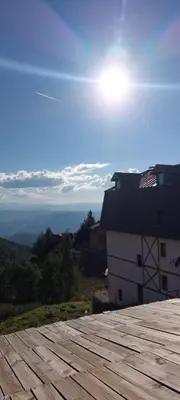 a view of a roof of a building with the sun at Mesečeva bajka in Kopaonik