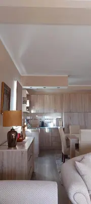 a living room with a kitchen and a dining room at Mesečeva bajka in Kopaonik