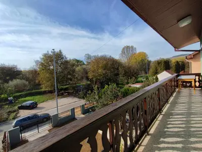 a balcony with a view of a parking lot at Apartmani Varos & Restaurant in Pirot